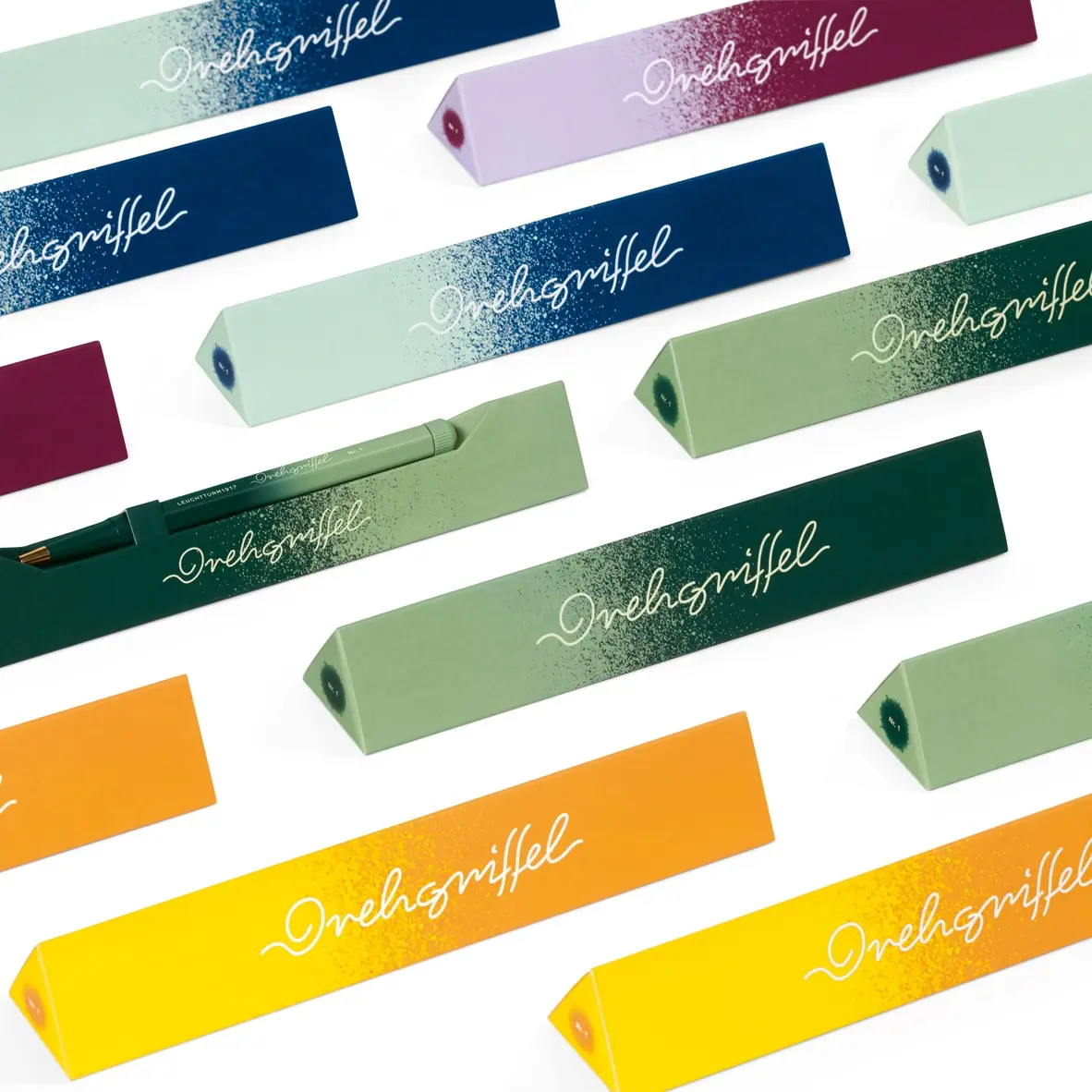 Drehgriffel Gradient Sonderedition Sortiment. Multiple colorful Drehgriffel boxes with gradient design and text “Drehgriffel”.