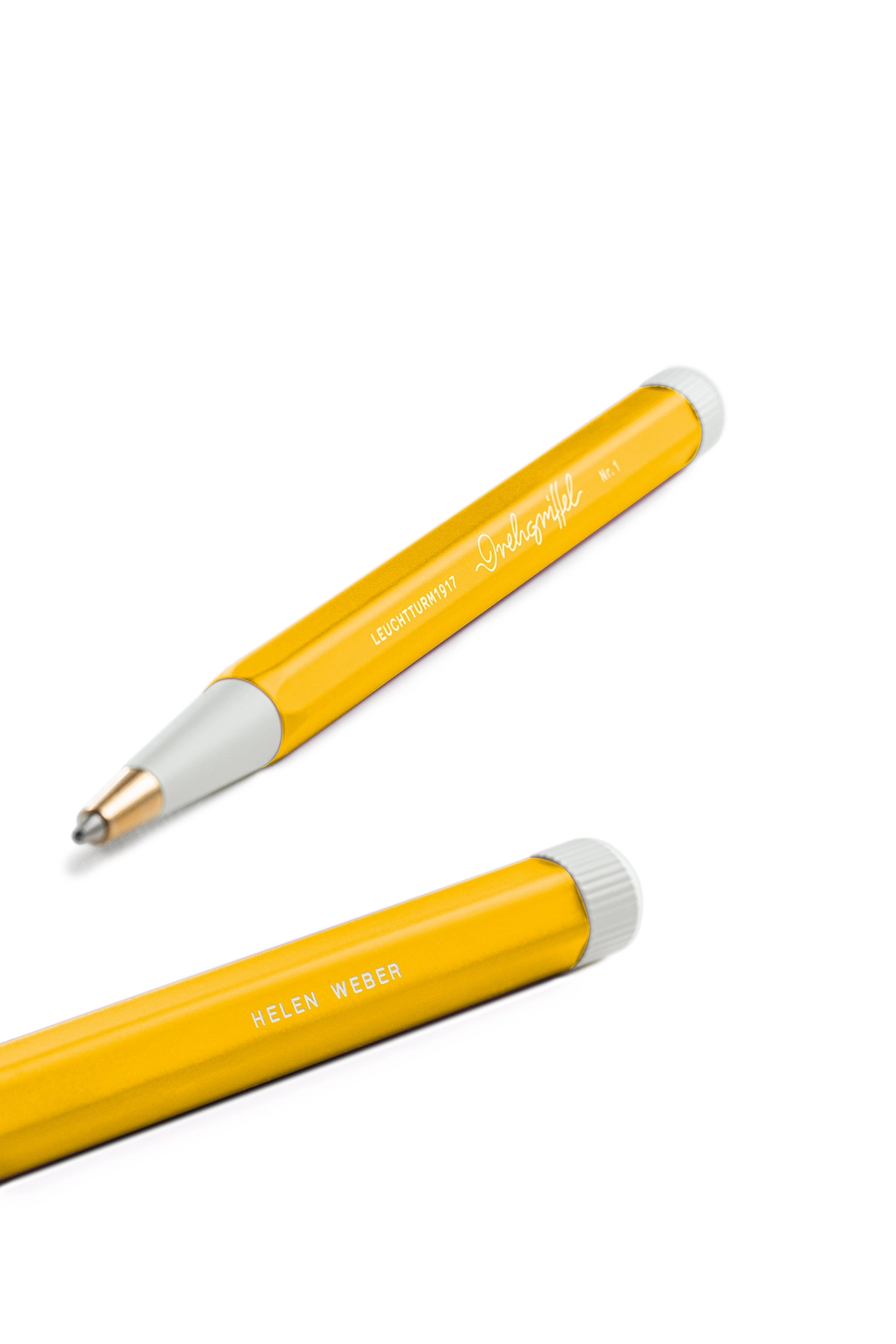 Two yellow and white Drehgriffel Nr. 1 with engraving “Helen Weber”.
