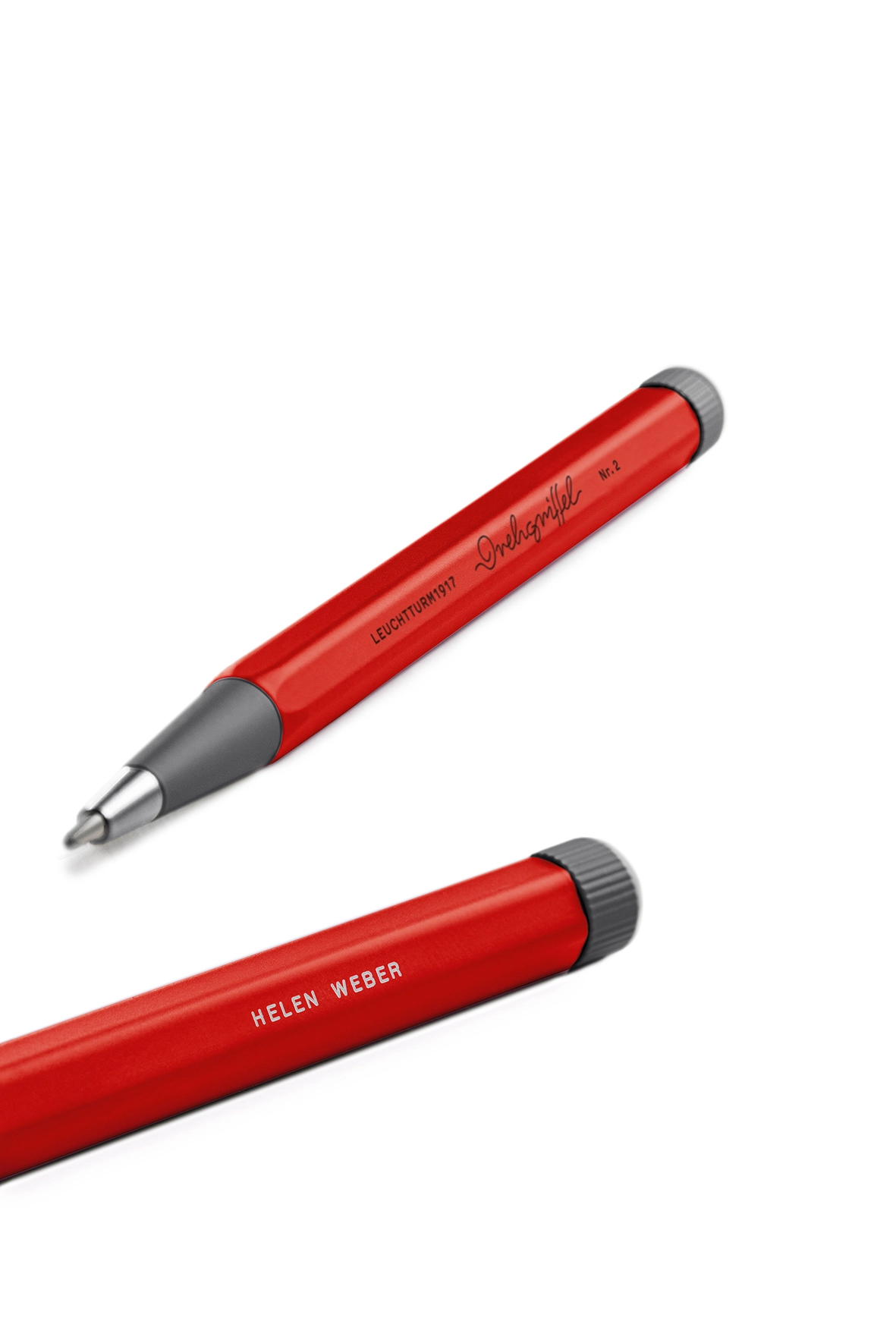 Two red and grey Drehgriffel Nr. 2 with engraving “Helen Weber”.