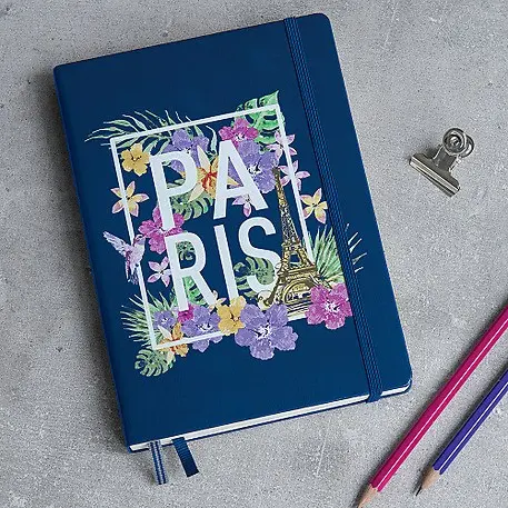 LEUCHTTURM1917 individuelles Notizbuch. Blue notebook with floral graphic, text “PARIS”, elastic band and bookmark.